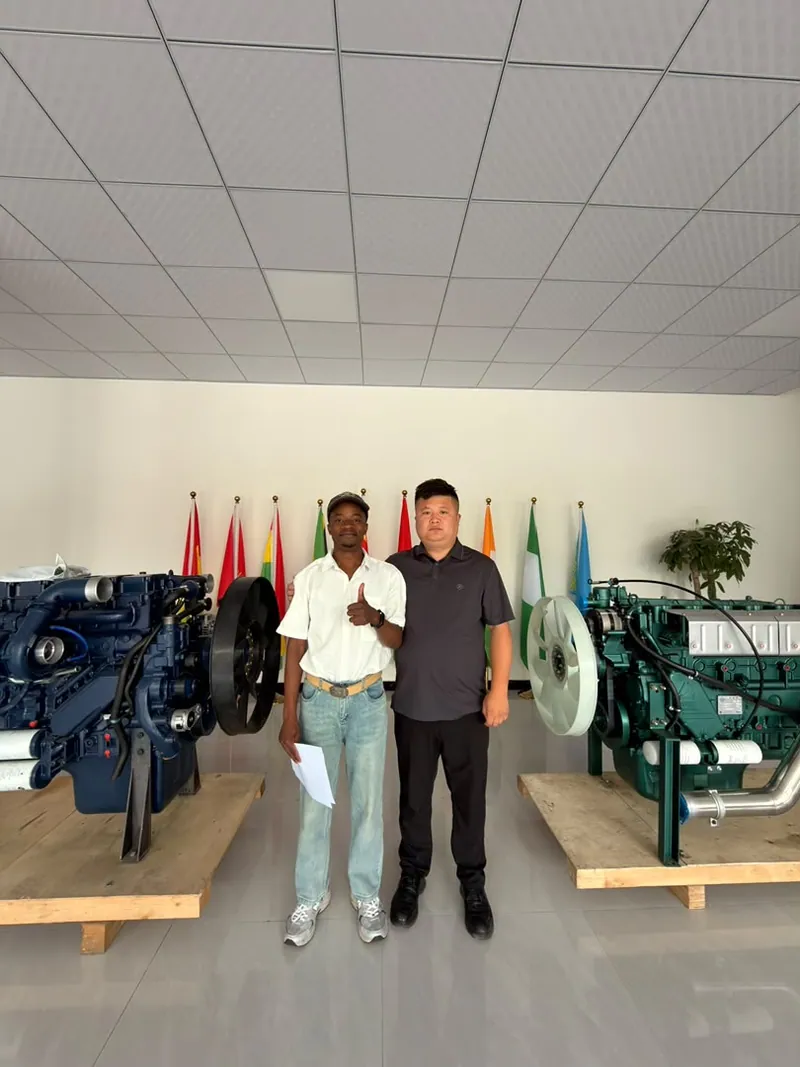 Colleagues inspecting engines on display in a supplier showroom